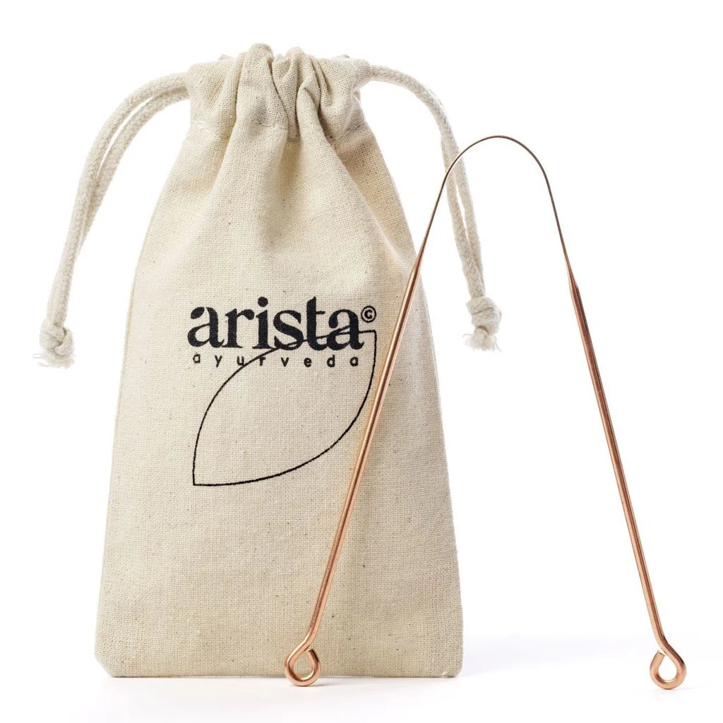 "Arista Ayurveda copper tongue scraper, shown with its accompanying branded natural cotton travel pouch."
