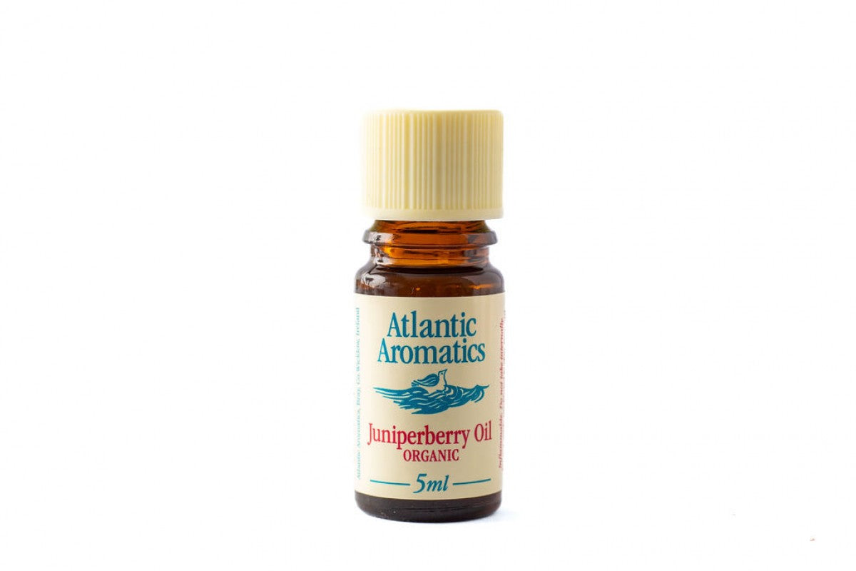A 5ml amber glass bottle of Atlantic Aromatics Organic Juniperberry Oil with a cream-colored ribbed cap on a white background.