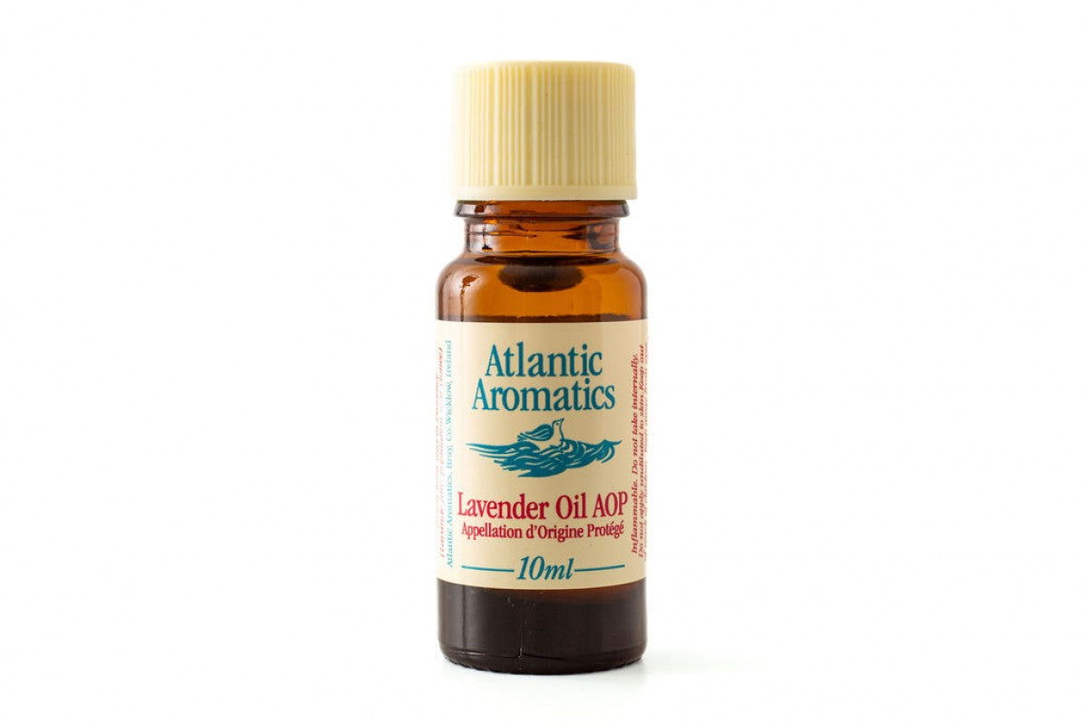 A 10ml amber glass bottle of Atlantic Aromatics Lavender Oil AOP (Appellation d'Origine Protégée) with a cream-colored ribbed cap on a white background.