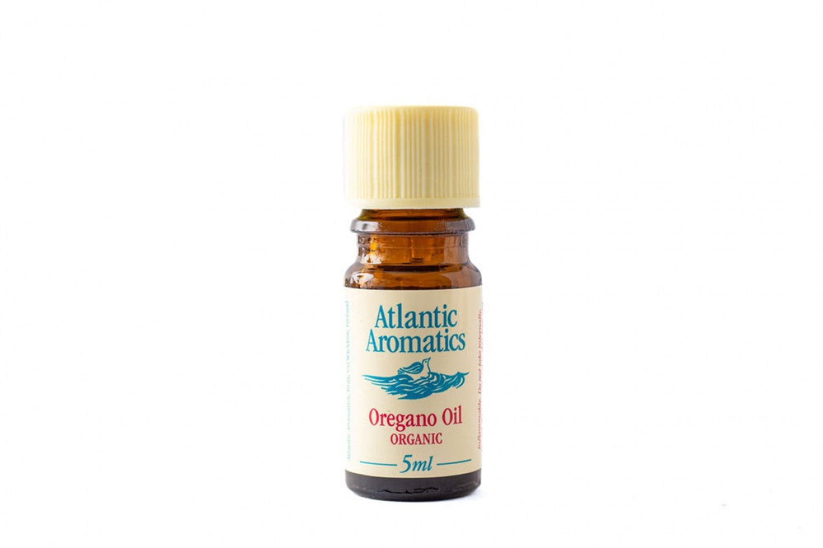 A 5ml amber glass bottle of Atlantic Aromatics Organic Oregano Oil with a cream ribbed cap on a white background.