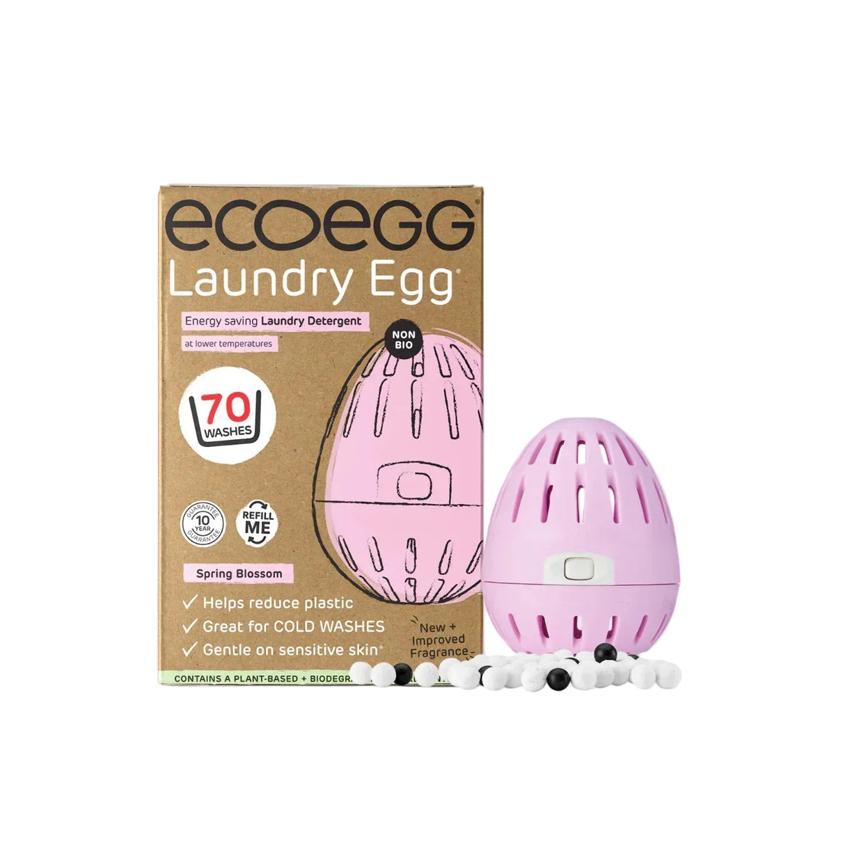 Eco Egg Laundry Egg in Spring Blossom scent, shown with its brown cardboard packaging box and the pink egg-shaped detergent dispenser alongside small plant-based detergent pods on a solid light pink background.