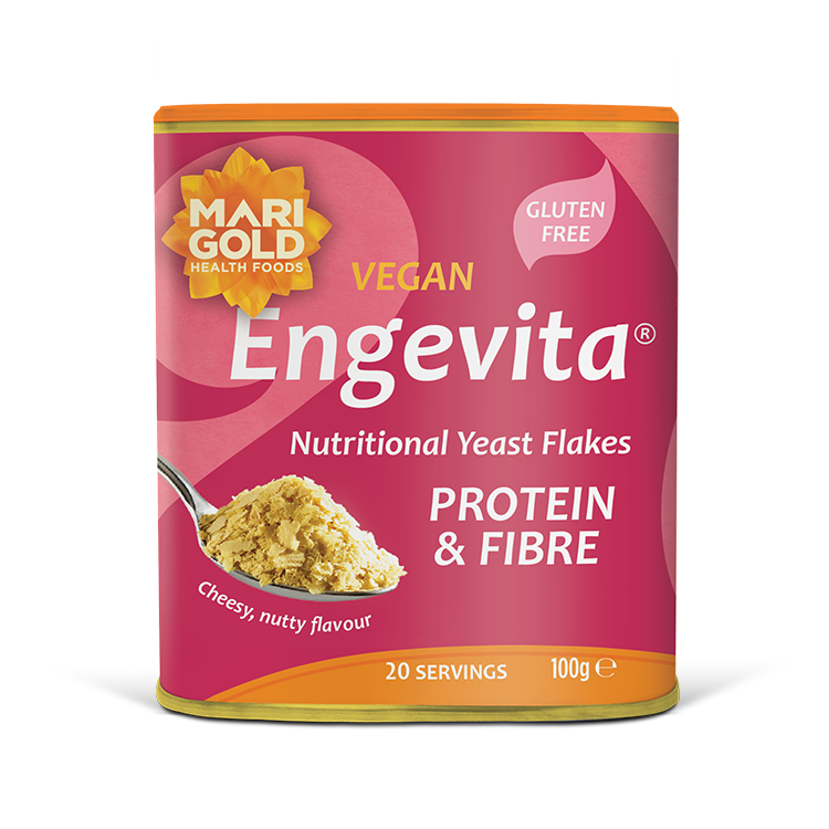 Marigold Engevita nutritional yeast flakes canister with protein & fibre on a solid black background.
