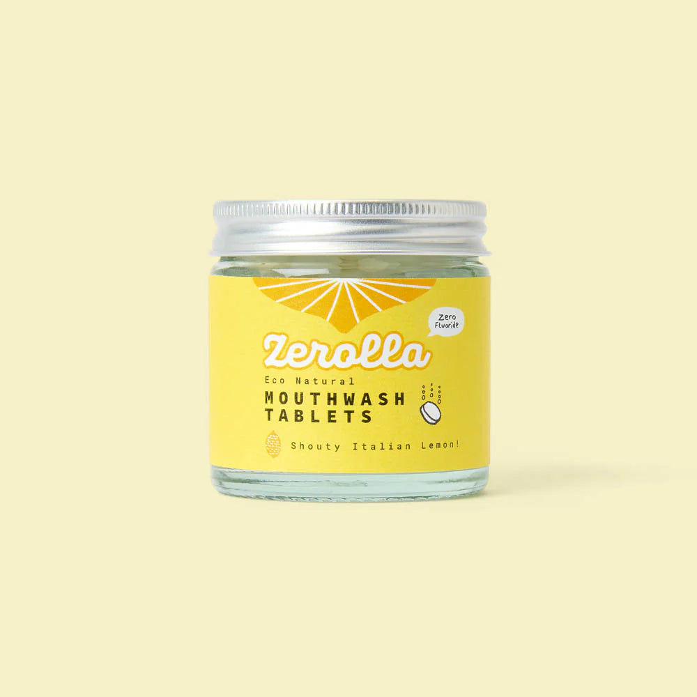 A glass jar of Zerolla eco-natural mouthwash tablets with a yellow label, featuring a "Shouty Italian Lemon" flavor and marked as "Zero Fluoride."