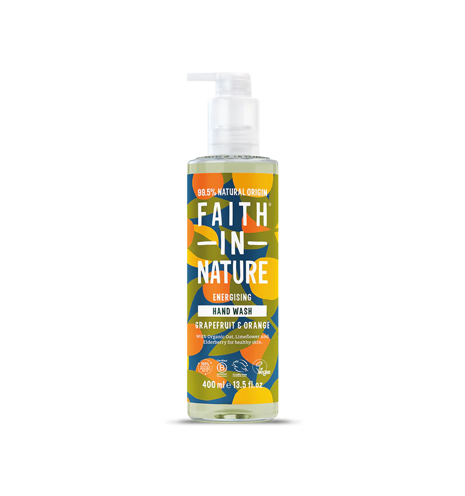 Brightly colored bottle of "Faith in Nature" hand wash with a pump, featuring bold text and abstract floral patterns. Grapefruit and orange scent.