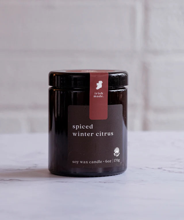 A 6oz Irish-made spiced winter citrus soy wax candle jar.