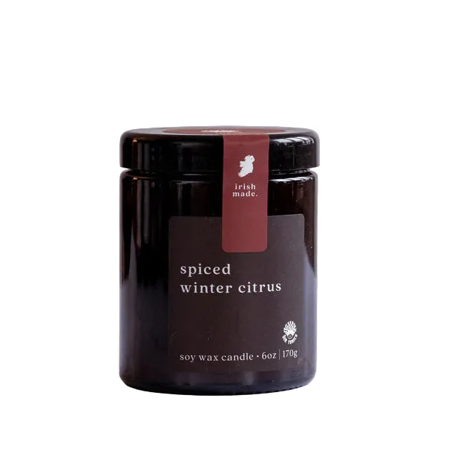 A 6oz Irish-made spiced winter citrus soy wax candle jar.