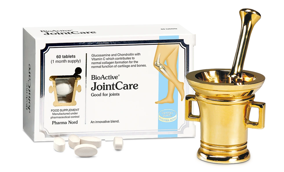BioActive JointCare supplement packaging box with loose white tablets in front, shown beside a decorative gold mortar and pestle on a white background.