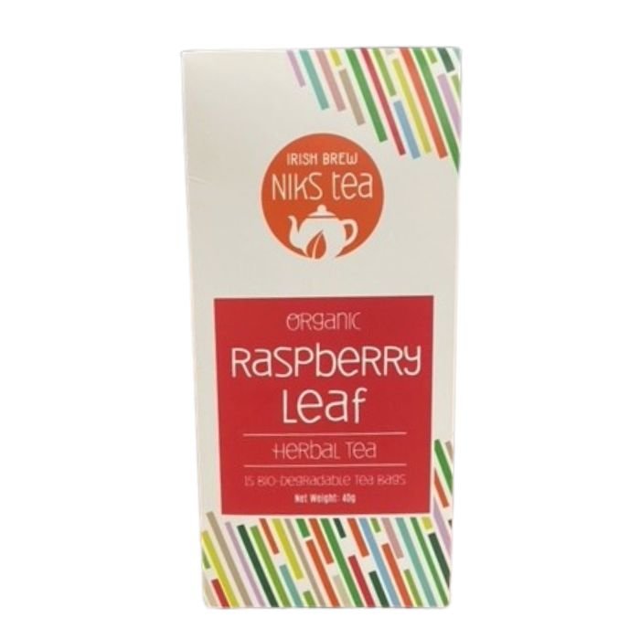 Box of organic raspberry leaf herbal tea from Nik's Tea. Cream-colored with colorful diagonal stripes and a red label indicating 15 tea bags.