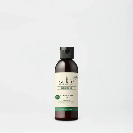 Sukin Signature Cleansing Oil in a dark amber bottle with cap.