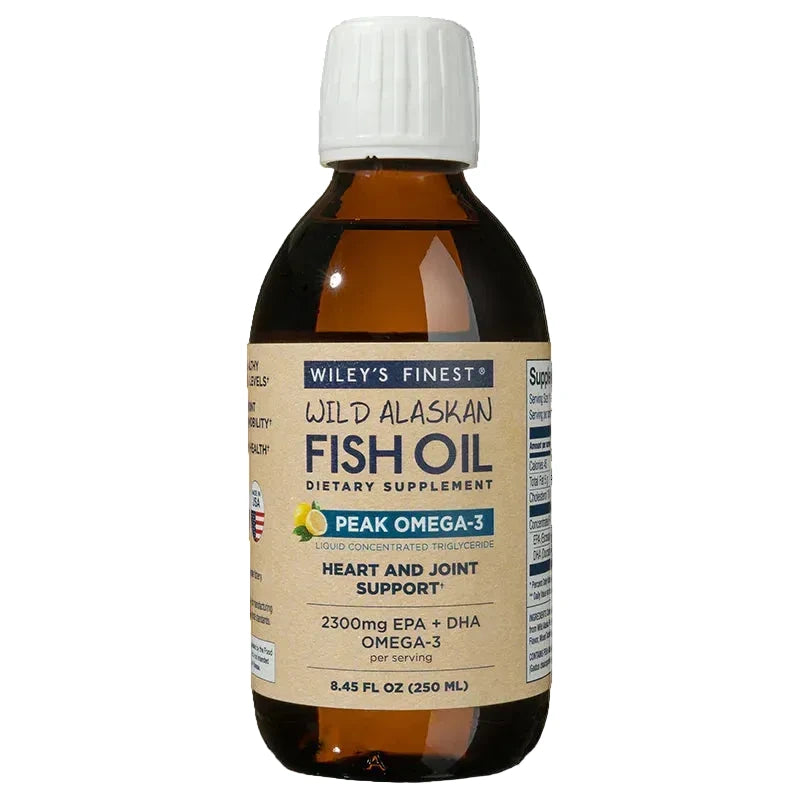 An 8.45 fl oz (250 ml) amber glass bottle of Wiley's Finest Wild Alaskan Fish Oil, Peak Omega-3 liquid dietary supplement for heart and joint support, featuring a white ribbed cap and a tan label with lemon imagery.
