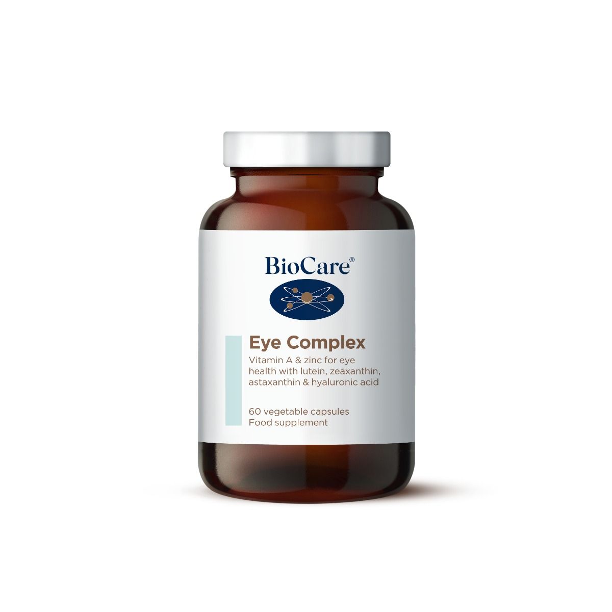 A 60-capsule amber glass jar of BioCare Eye Complex food supplement with a white and light blue label and silver cap, isolated on a white background.