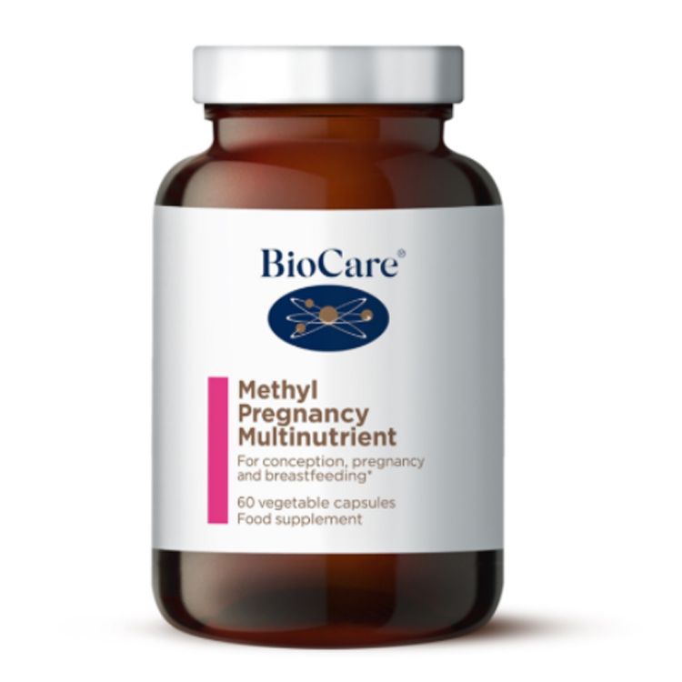 A 60-capsule amber glass jar of BioCare Methyl Pregnancy Multinutrient food supplement with a white and pink label and silver cap, isolated on a white background.