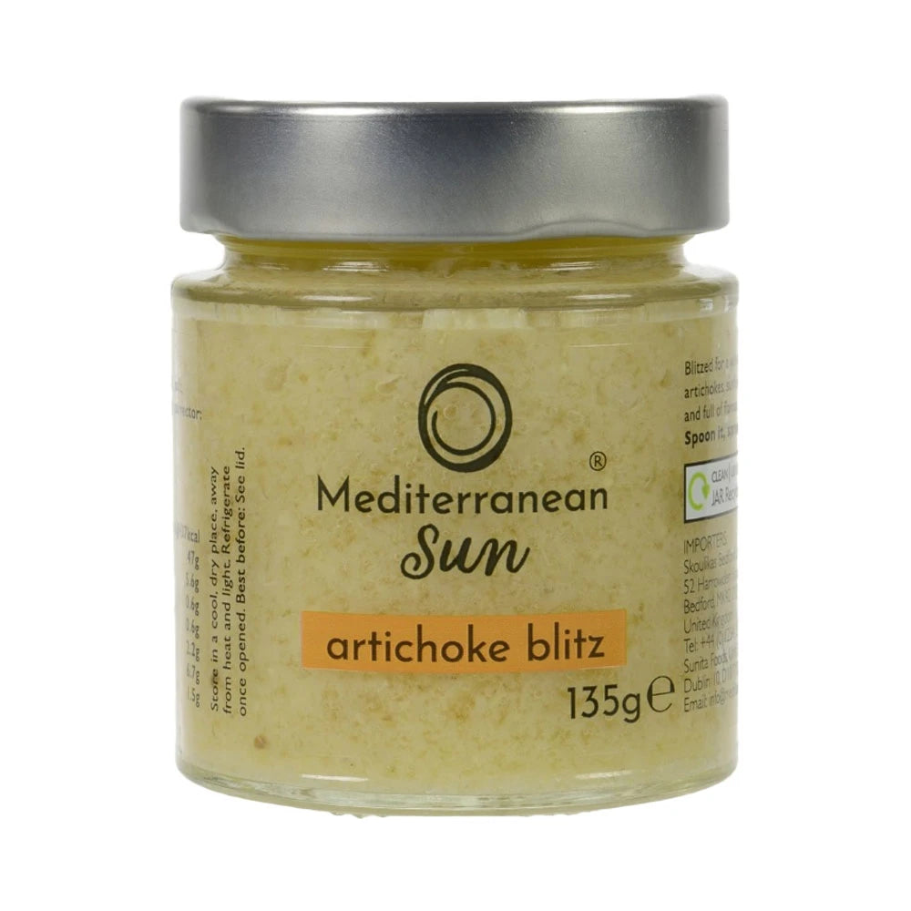 A glass jar with a metal lid labeled "Mediterranean Sun Artichoke Blitz, 135g". The jar contains a yellowish paste, suggesting a creamy artichoke spread.