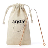 "Arista Ayurveda copper tongue scraper, shown with its accompanying branded natural cotton travel pouch."