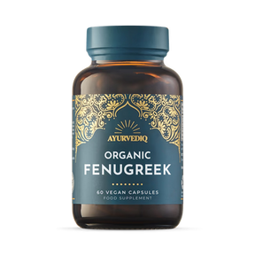 Brown bottle with a blue label, featuring intricate gold designs. Text reads "AYURVEDIQ Organic Fenugreek, 60 Vegan Capsules, Food Supplement."