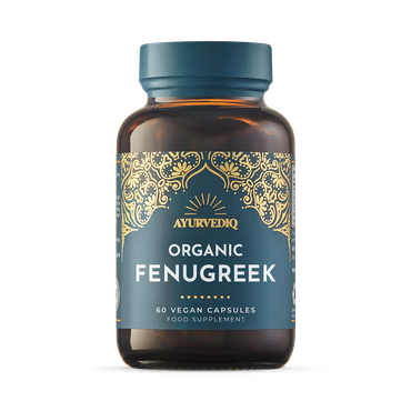 Brown bottle with a blue label, featuring intricate gold designs. Text reads "AYURVEDIQ Organic Fenugreek, 60 Vegan Capsules, Food Supplement."