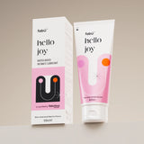 Packaging of "Hello Joy" water-based intimate lubricant is shown. A 100ml pink and white box and tube are displayed against a neutral background.