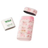 "Wild deodorant set featuring a refillable case and a 40g deodorant refill, designed in collaboration with LoveShackFancy and adorned with a pink floral and bow print."