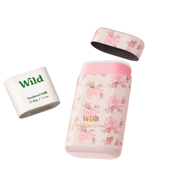 "Wild deodorant set featuring a refillable case and a 40g deodorant refill, designed in collaboration with LoveShackFancy and adorned with a pink floral and bow print."
