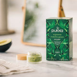 Pukka Supreme Matcha Green organic tea, 20 sachets, displayed next to a small jar of green matcha mask.