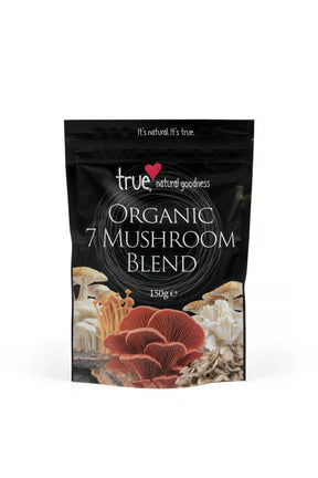 A 150g black resealable pouch of True Organic 7 Mushroom Blend, featuring a variety of colorful mushroom illustrations at the base and a white circular line design.