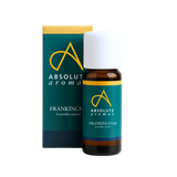 Bottle and box of Absolute Aromas Frankincense oil on a white background