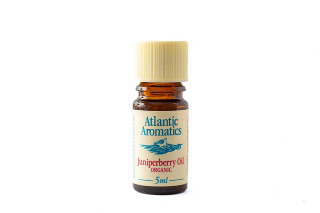 A 5ml amber glass bottle of Atlantic Aromatics Organic Juniperberry Oil with a cream-colored ribbed cap on a white background.