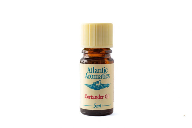 A 5ml amber glass bottle of Atlantic Aromatics Coriander Oil with a cream-colored cap against a white background.