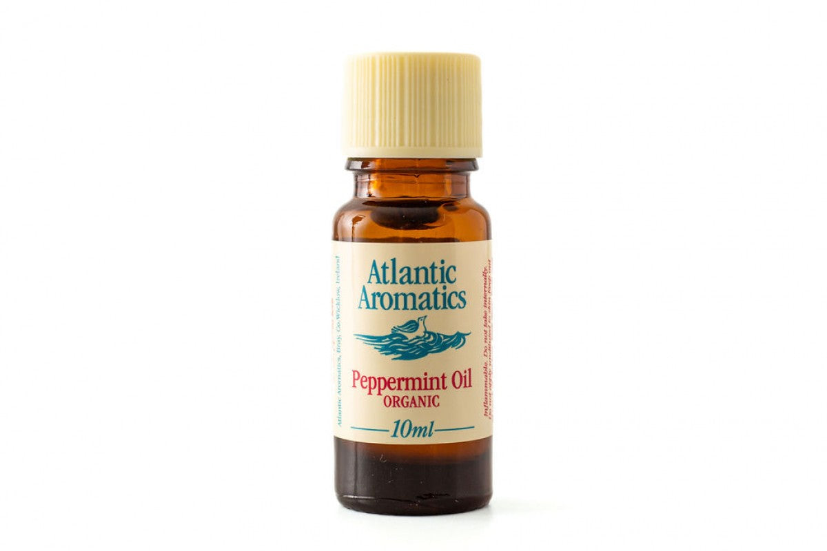 A 10ml amber glass bottle of Atlantic Aromatics Organic Peppermint Oil with a cream-colored ribbed cap on a white background.