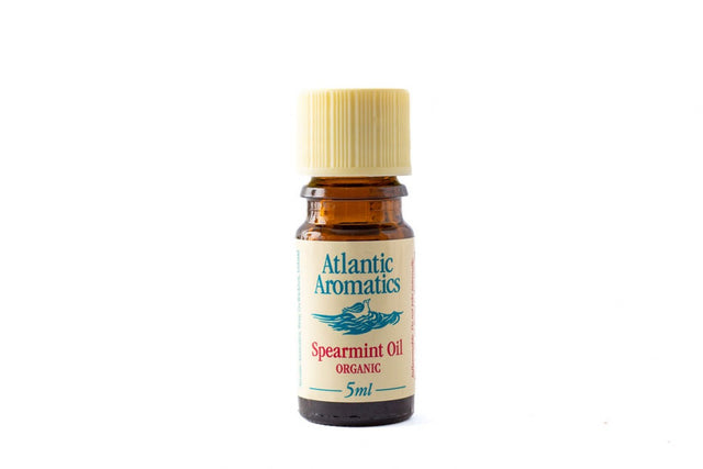 A 5ml amber glass bottle of Atlantic Aromatics Organic Spearmint Oil with a ribbed cream cap on a white background.