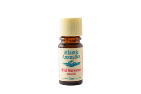 A 5ml amber glass bottle of Atlantic Aromatics Organic Wild Marjoram essential oil with a cream-colored ribbed cap on a white background.