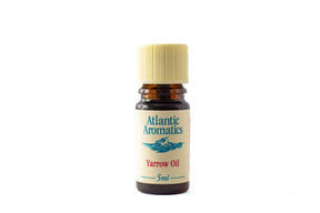 A 5ml amber glass bottle of Atlantic Aromatics Yarrow Oil with a cream label and a ribbed beige cap.
