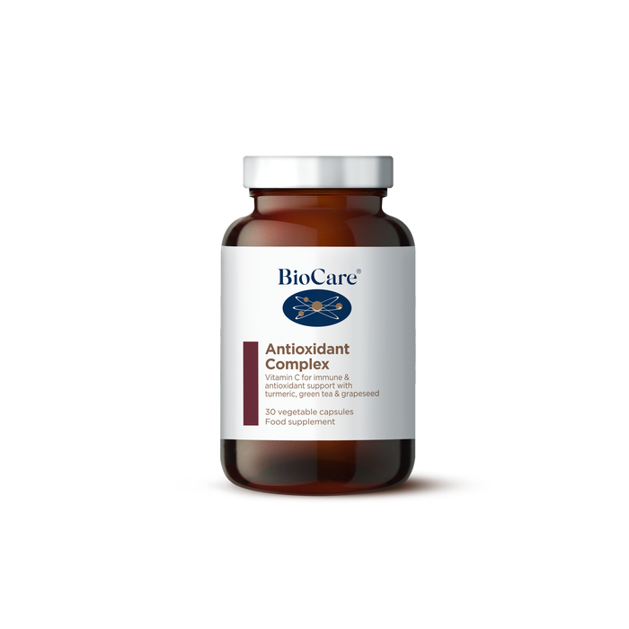 A 30-capsule amber glass jar of BioCare Antioxidant Complex food supplement with a white and maroon label and silver cap, isolated on a white background.