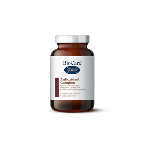 A 30-capsule amber glass jar of BioCare Antioxidant Complex food supplement with a white and maroon label and silver cap, isolated on a white background.