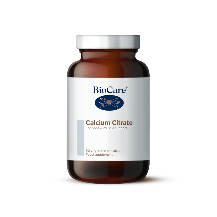 A 90-vegetable capsule amber glass jar of BioCare Calcium Citrate food supplement for bone and muscle support, featuring a white and light grey label and silver cap, isolated on a white background.