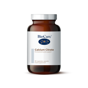 A 90-vegetable capsule amber glass jar of BioCare Calcium Citrate food supplement for bone and muscle support, featuring a white and light grey label and silver cap, isolated on a white background.