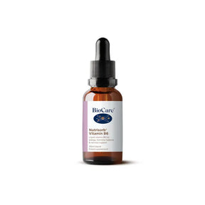 A 30ml amber glass dropper bottle of BioCare Nutrisorb Vitamin B6 liquid food supplement with a white and purple label, isolated on a white background.