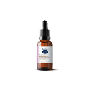 A 15ml amber glass dropper bottle of BioCare Nutrisorb BioMulsion D liquid emulsified vitamin D3 for immune and bone support, featuring a white and purple label, isolated on a black background.