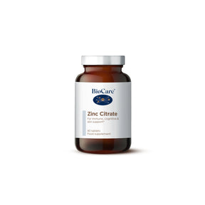 A 90-tablet amber glass jar of BioCare Zinc Citrate food supplement for immune, cognitive, and skin support, featuring a white and grey label and silver cap, isolated on a white background.