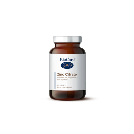 A 90-tablet amber glass jar of BioCare Zinc Citrate food supplement for immune, cognitive, and skin support, featuring a white and grey label and silver cap, isolated on a white background.