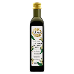 A 250ml bottle of Biona Organic Toasted Sesame Oil, featuring a dark glass bottle with a gold cap and a white label with green and gold accents, set against a plain white background.
