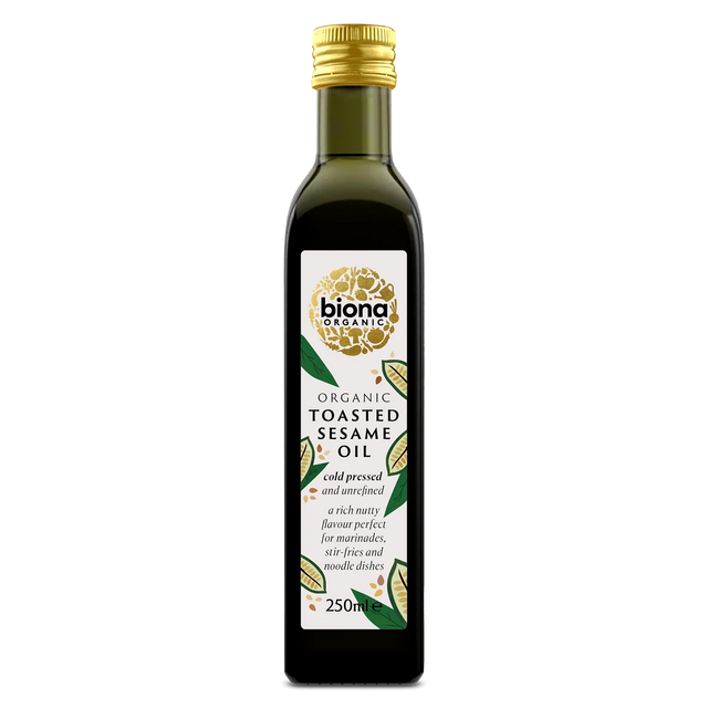 A 250ml bottle of Biona Organic Toasted Sesame Oil, featuring a dark glass bottle with a gold cap and a white label with green and gold accents, set against a plain white background.