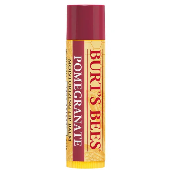 A Burt’s Bees "Pomegranate" Moisturizing Lip Balm tube, featuring a deep burgundy cap and a cream-colored label with a subtle honeycomb and pomegranate seed pattern.