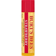 A Burt’s Bees "Strawberry" Moisturizing Lip Balm tube, featuring a bright red cap and a cream-colored label with a faint strawberry and honeycomb pattern.
