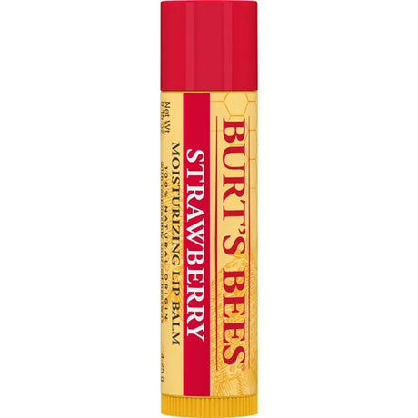 A Burt’s Bees "Strawberry" Moisturizing Lip Balm tube, featuring a bright red cap and a cream-colored label with a faint strawberry and honeycomb pattern.