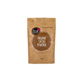 A 120g brown paper pouch of True Organic Cacao Powder with a brown circular logo and cacao bean illustrations.