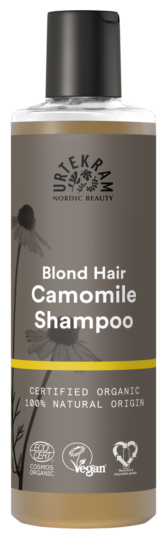 A tall bottle of Urtekram Camomile Shampoo for blond hair with a grey and brown label featuring camomile flower illustrations and a thin yellow horizontal stripe. The label indicates it is certified organic, 100% natural origin, and carries Vegan and Ecocert COSMOS Organic certifications.
