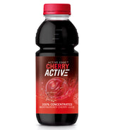 A bottle of CherryActive concentrate with a red cap and a dark liquid inside, featuring a label with a large splash of cherry juice and the text "100% Concentrated Montmorency Cherry Juice.
