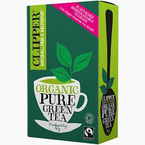 Box of Clipper Organic Pure Green Tea with green leaves and a white cup on a green background.
