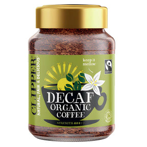 Glass jar of Clipper Decaf Organic instant coffee with gold lid.